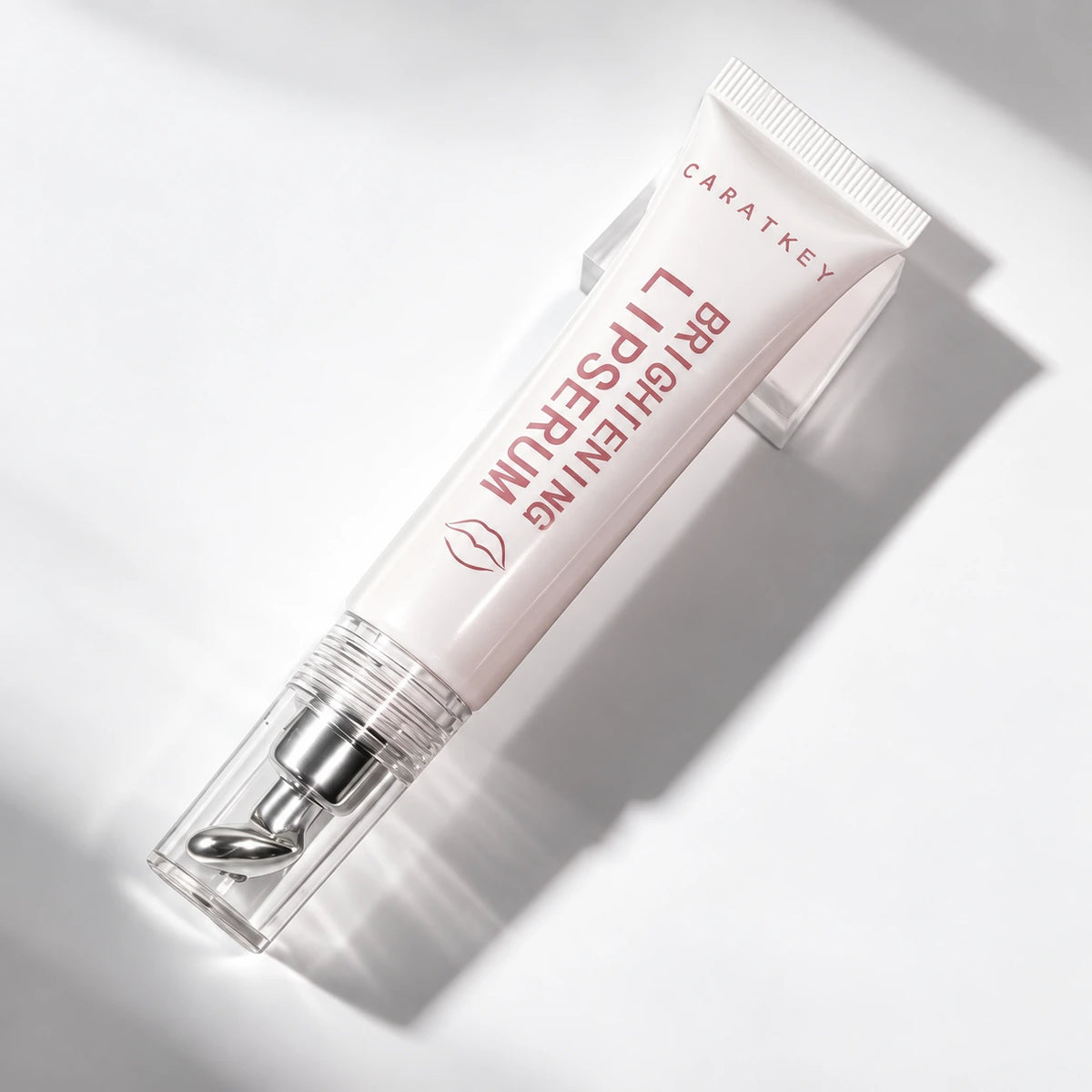 Lsheer Shimmer Caratkey lip essence capped tube on acrylic