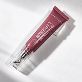 Red Bean Caratkey lip essence capped tube on acrylic