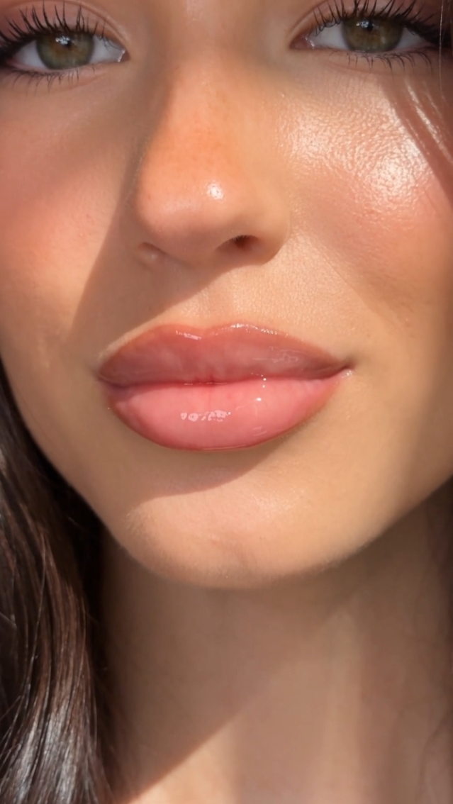 Close-up of lips with a glossy finish after application